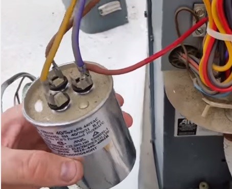 failed capacitor causing air conditioner fan to spin slow