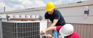 men installing air conditioner