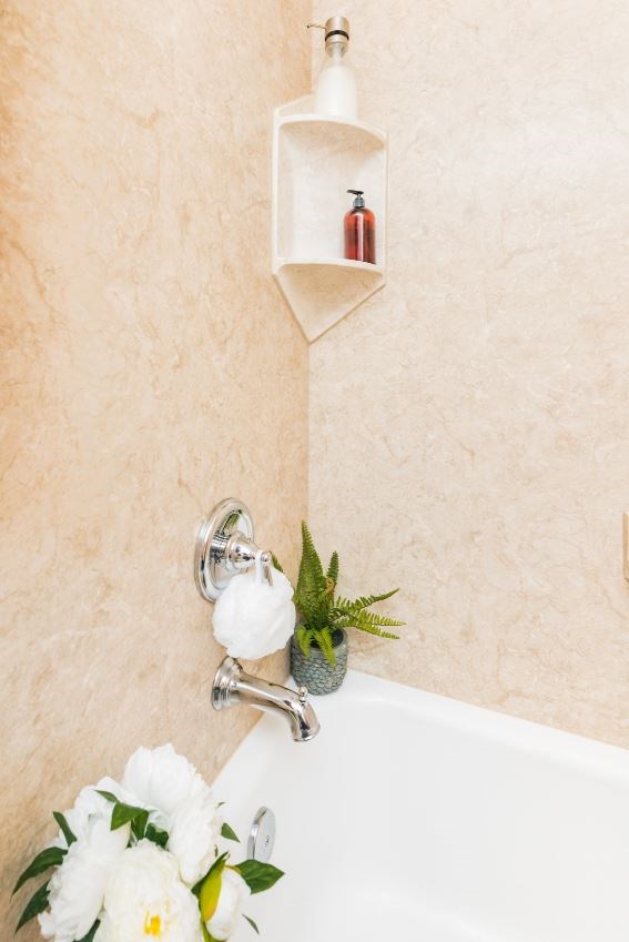 remodeled shower bathtub with beige walls 
