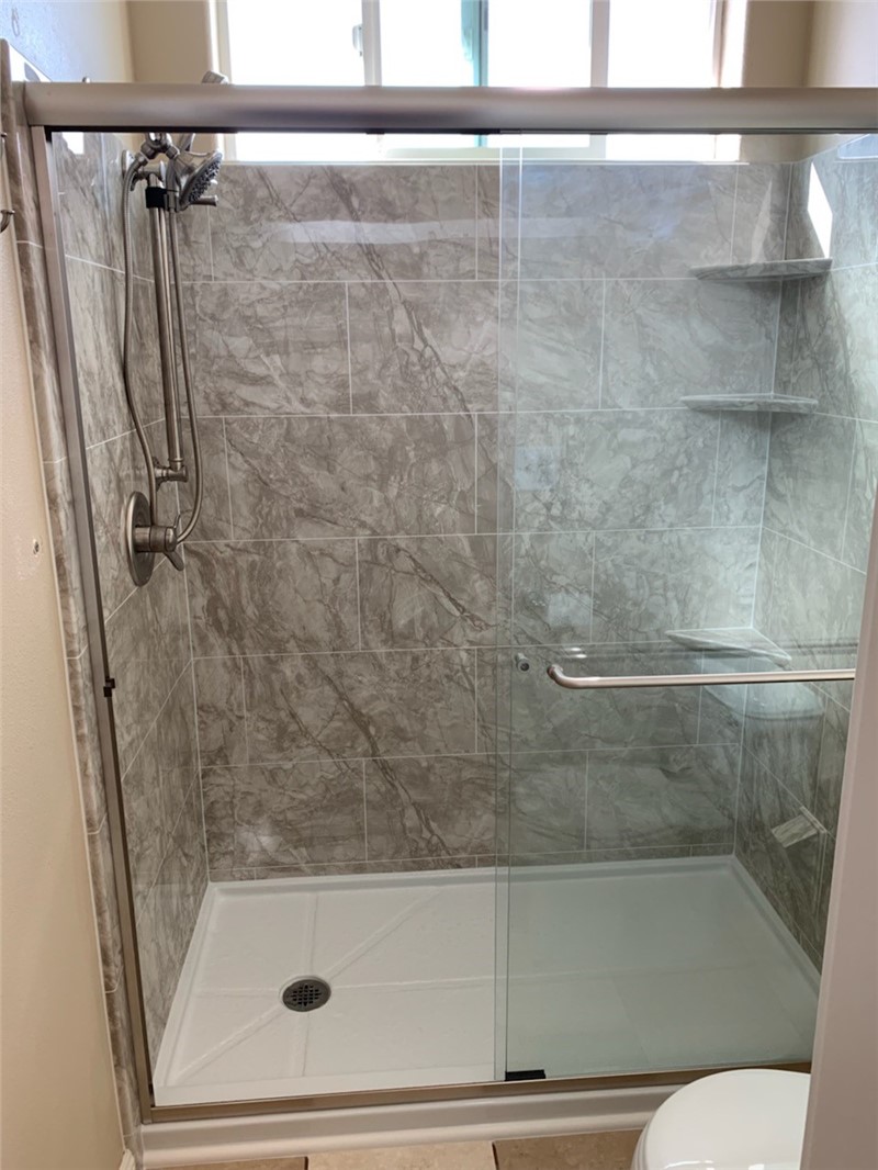 Tub to Shower Conversion with Clean Shower Door
