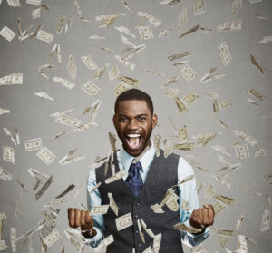 happy man getting cash rained down upon him