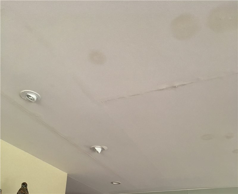 water spots on ceiling after heavy rain